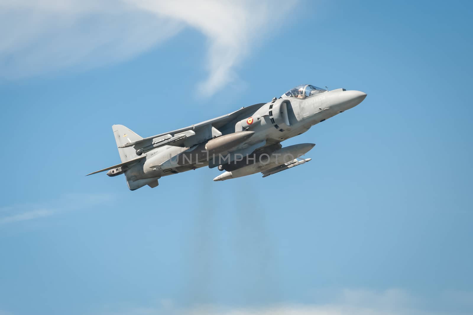 Farnborough, UK - July 18, 2014: A Spanish navy Harrier jump jet performing a vertical thrust hover maneuver near Farnborough, Hampshire, UK