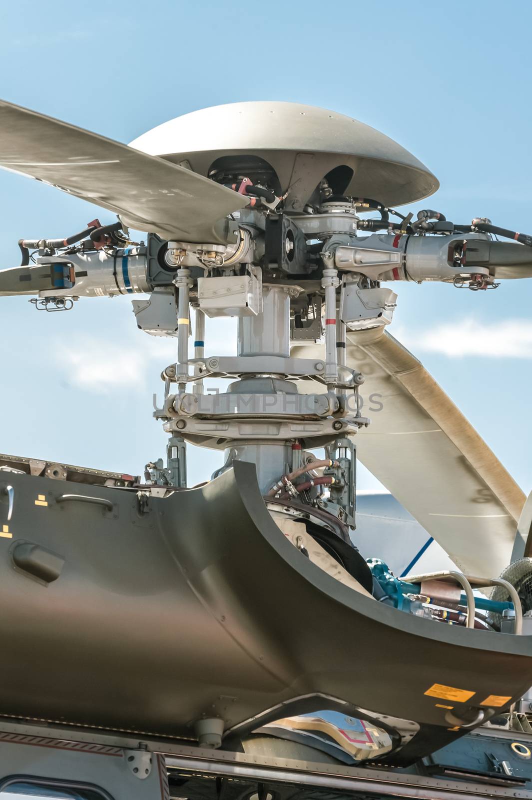 closeup of a complex helicopter rotor blade mechanical parts