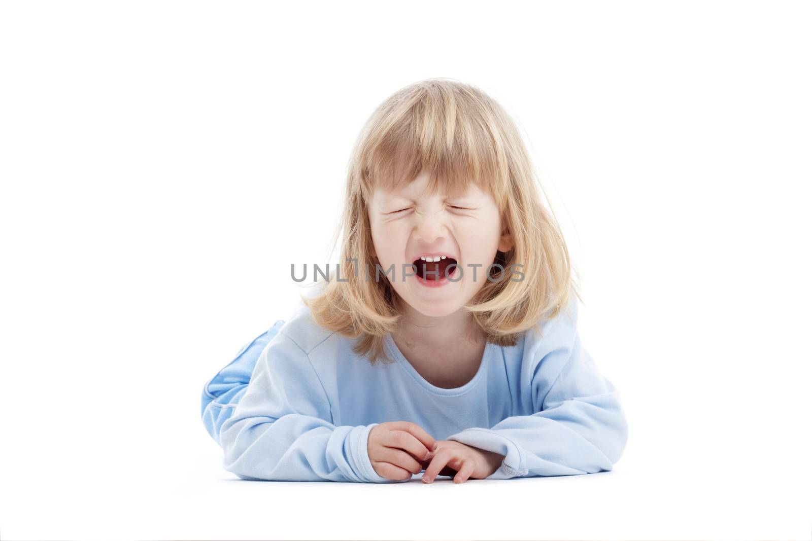 boy with long blond hair on the floor, screaming - isolated on white