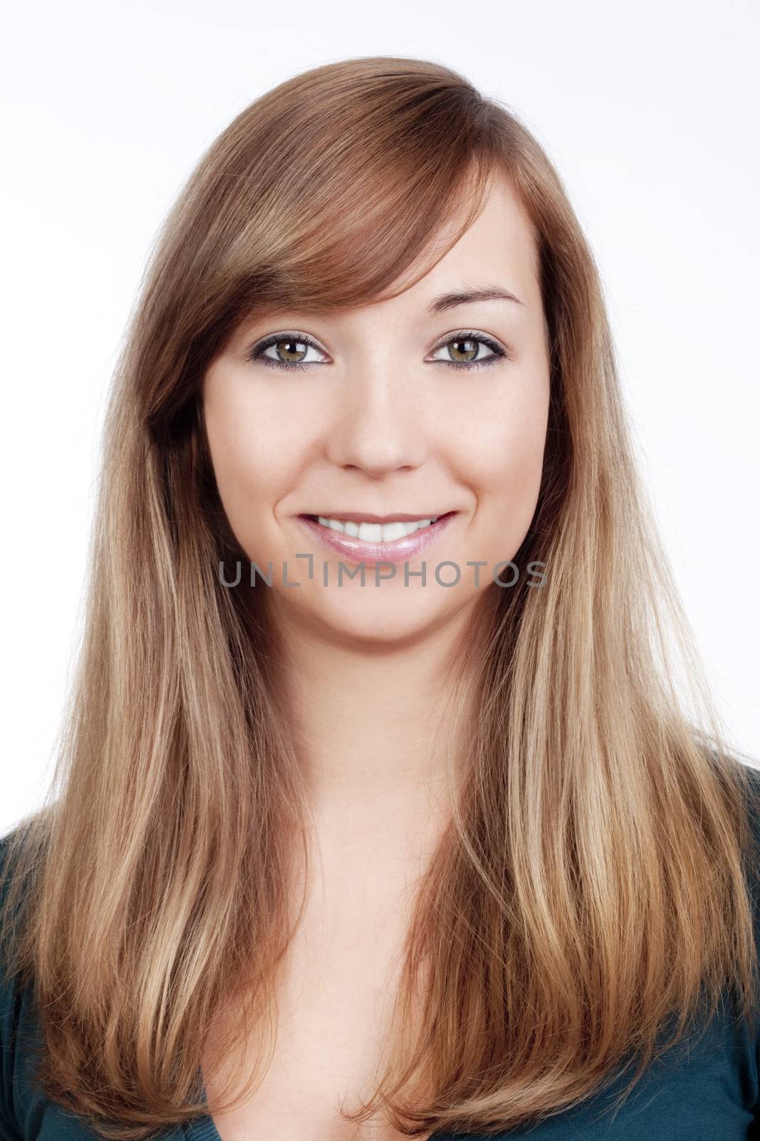 portrait of a young woman standing, smiling - isolated on white