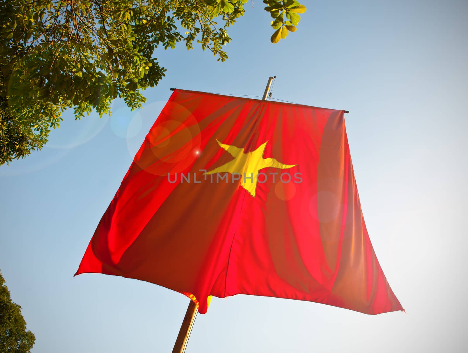 Vietnam flag with lens flare.