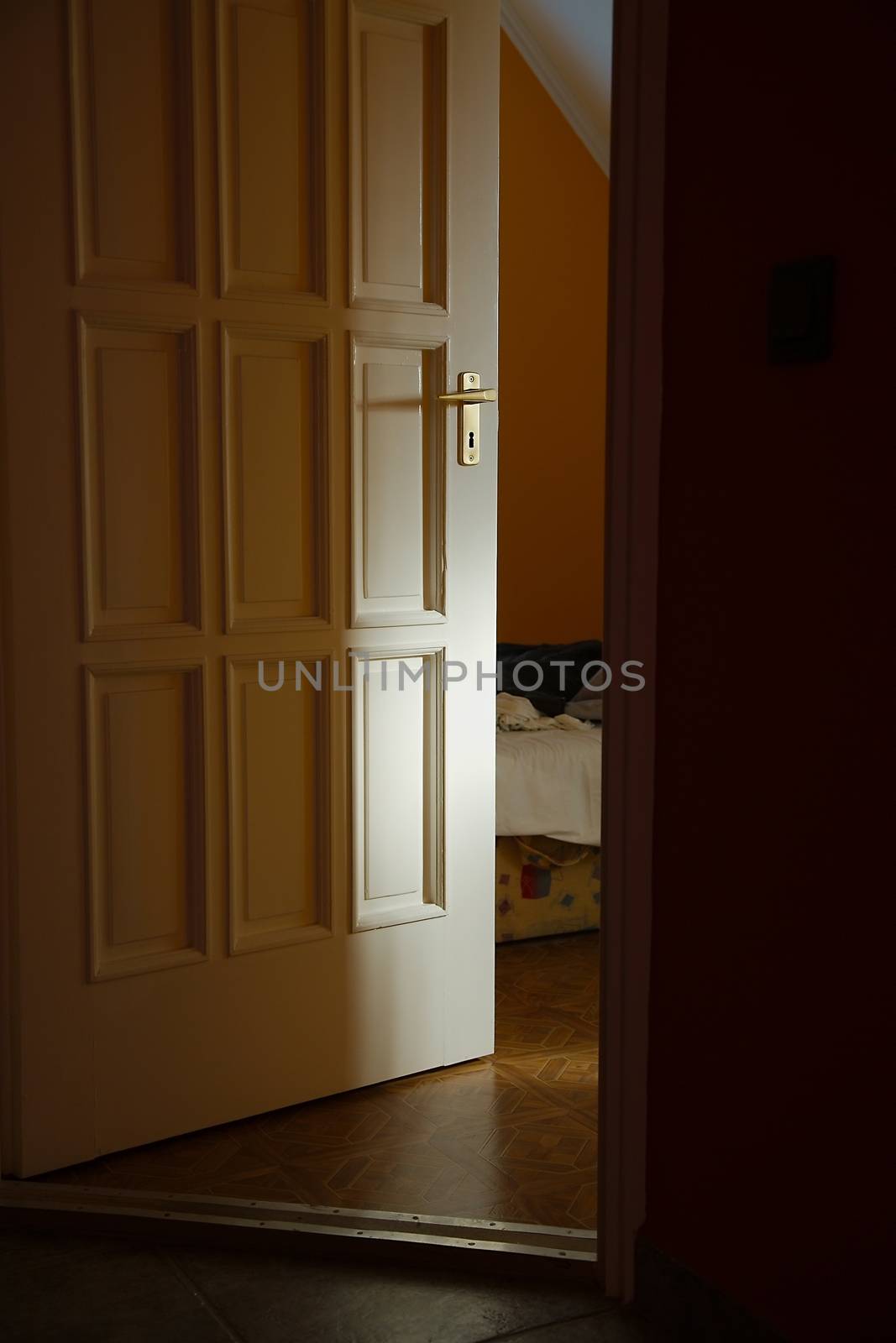 Light coming from a room with door left ajar