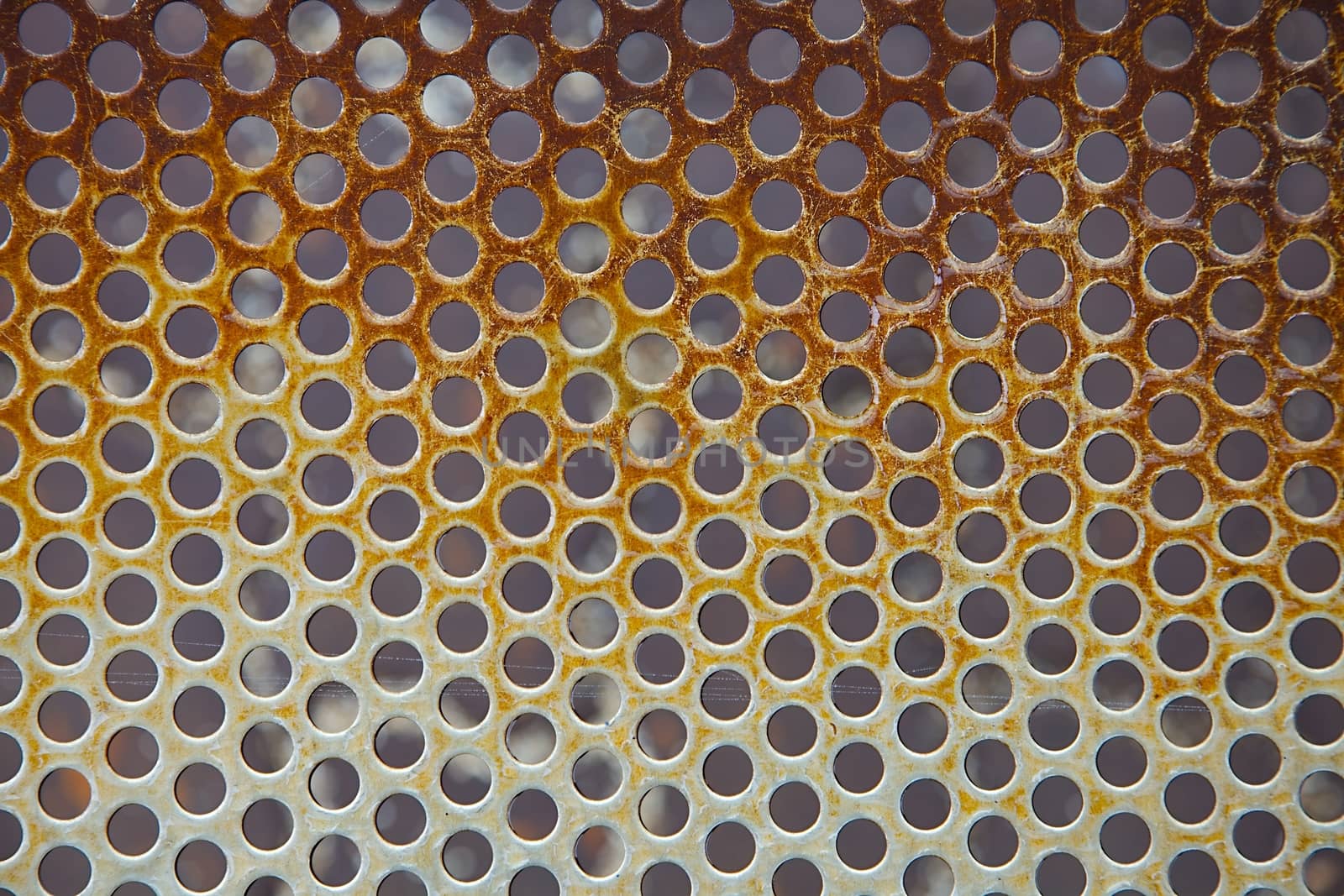 Rusty metal hole mesh pattern