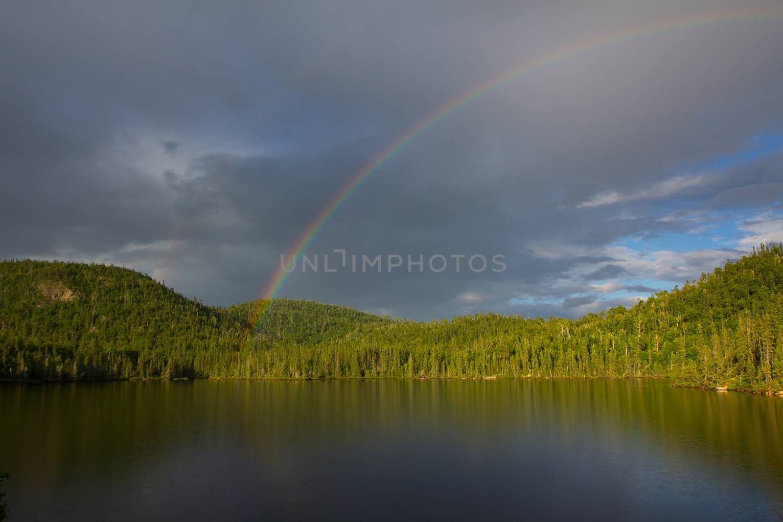 rainbow over the lake, Northern Ontario, Canada