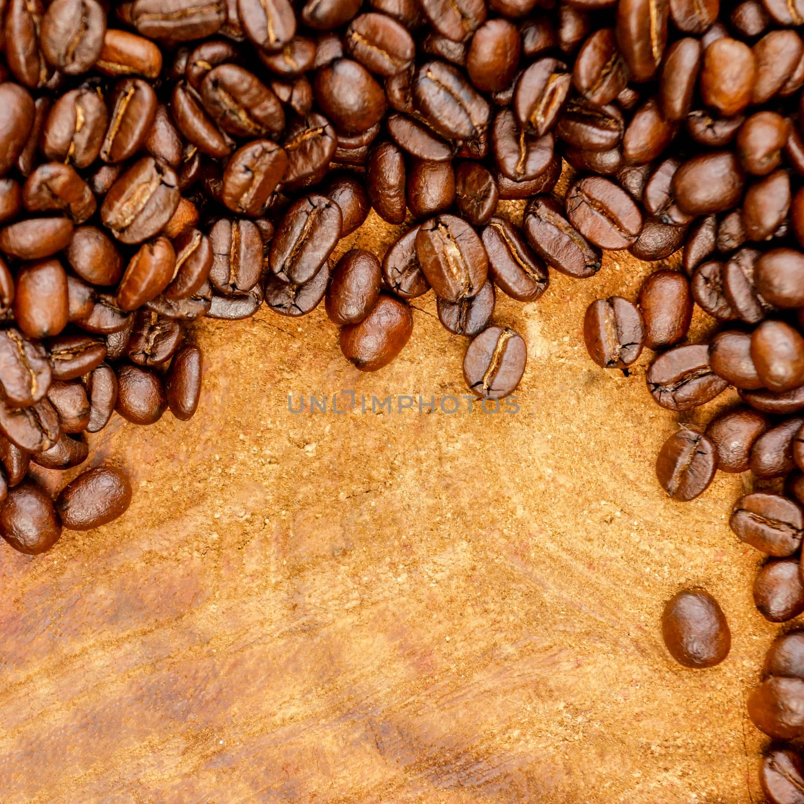 Coffee bean on wood background by Noppharat_th