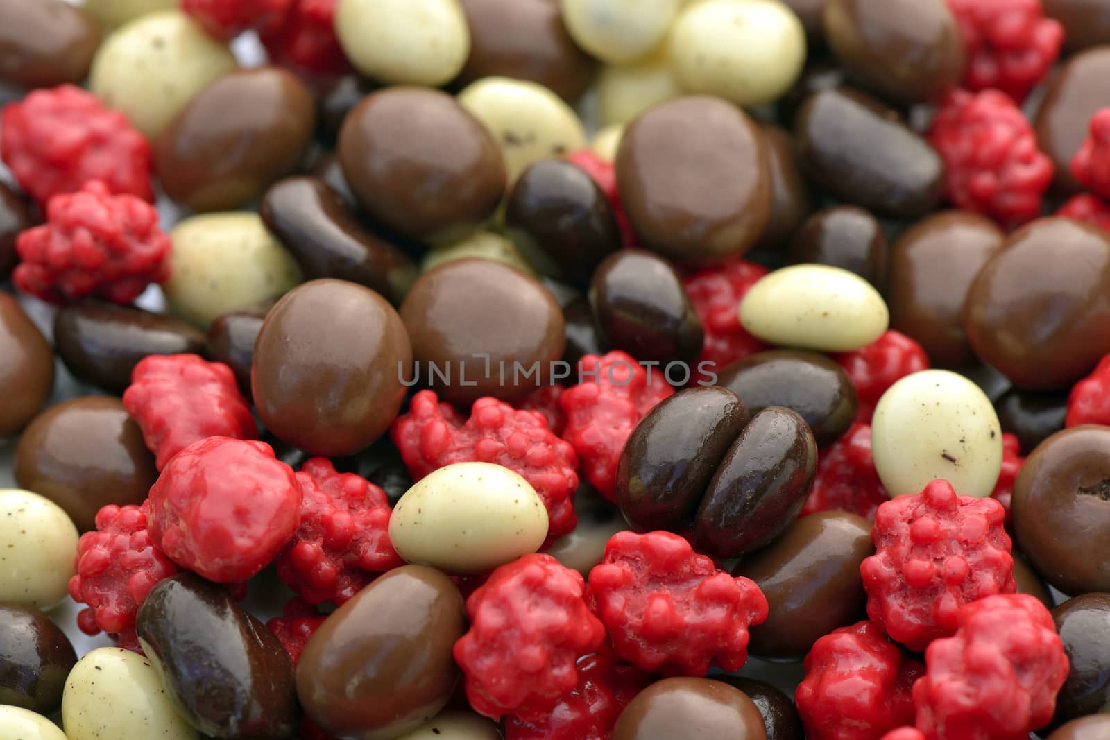 Close-up of mixed chocolate-covered coffee beans to use as background