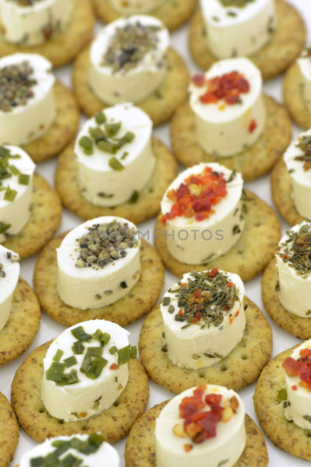 Close-up of cheese appetizers decorated with spices and vegetable