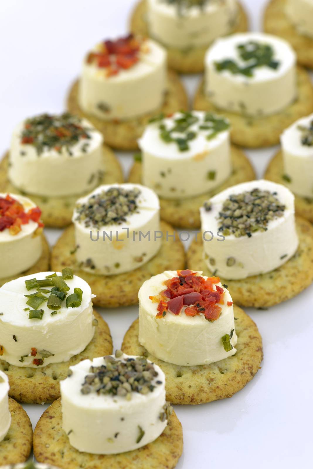 Close-up of cheese appetizers decorated with spices and vegetable