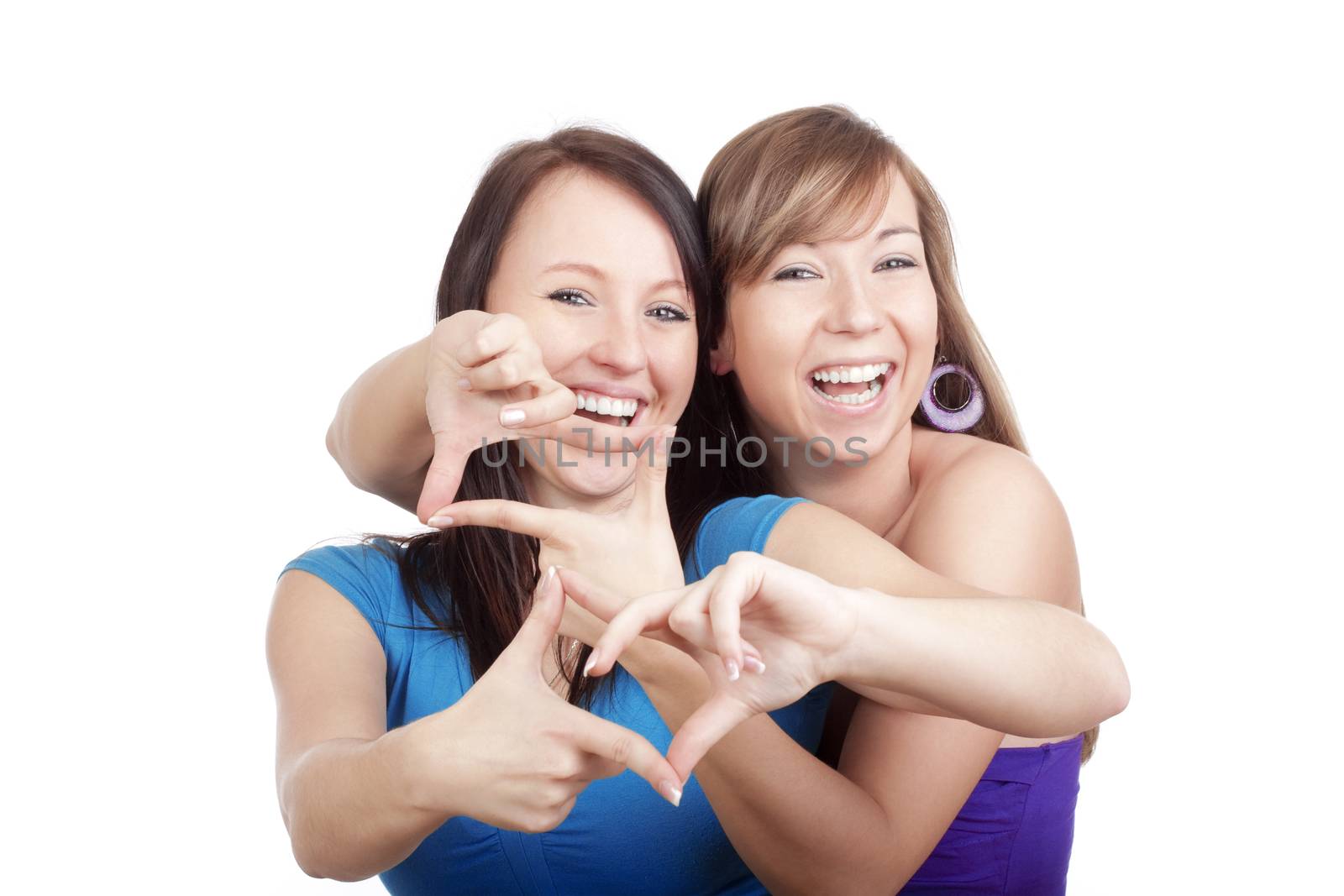 two happy young women smiling, making gestures - isolated on white