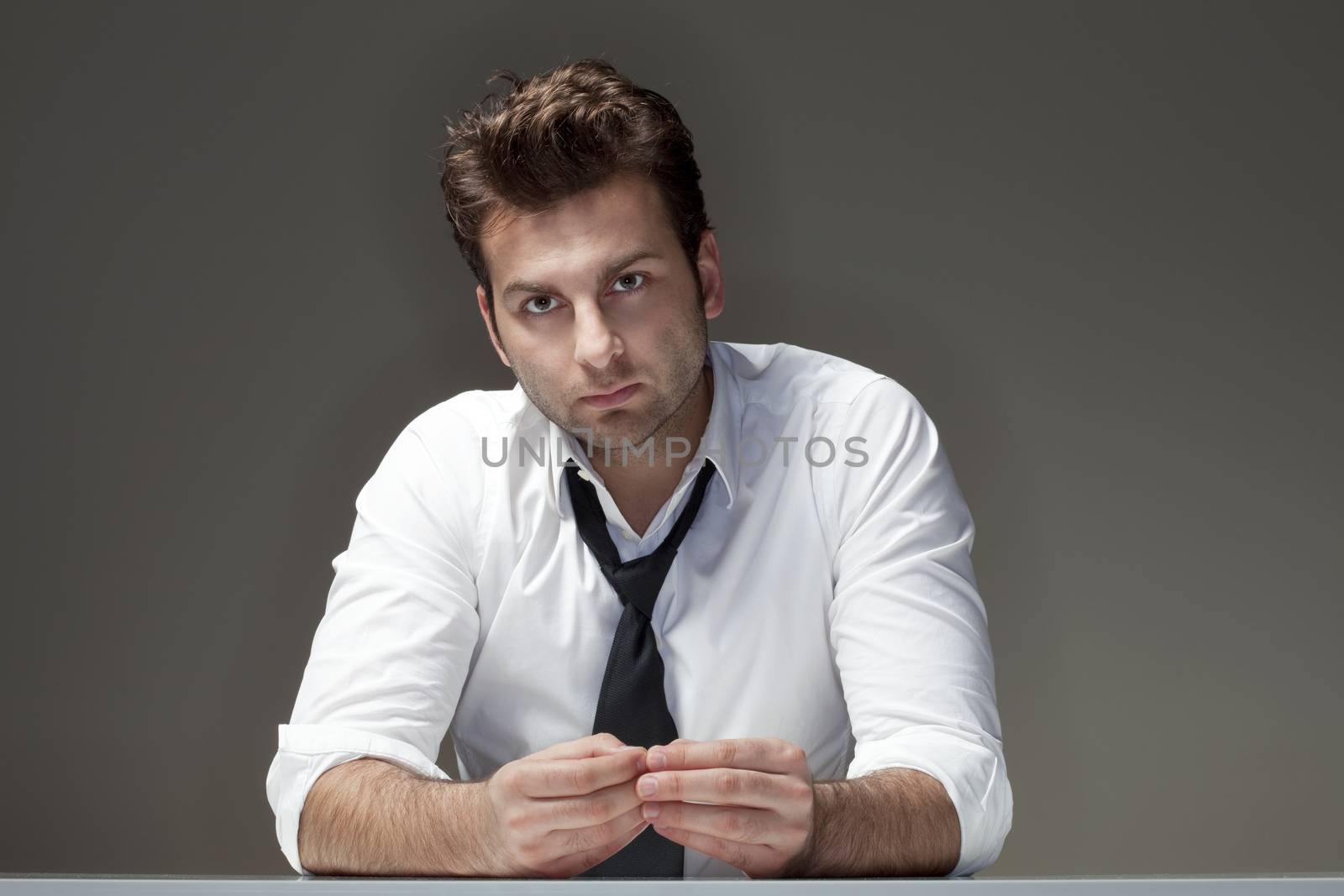 businessman in white shirt looking, thinking - isolated on gray