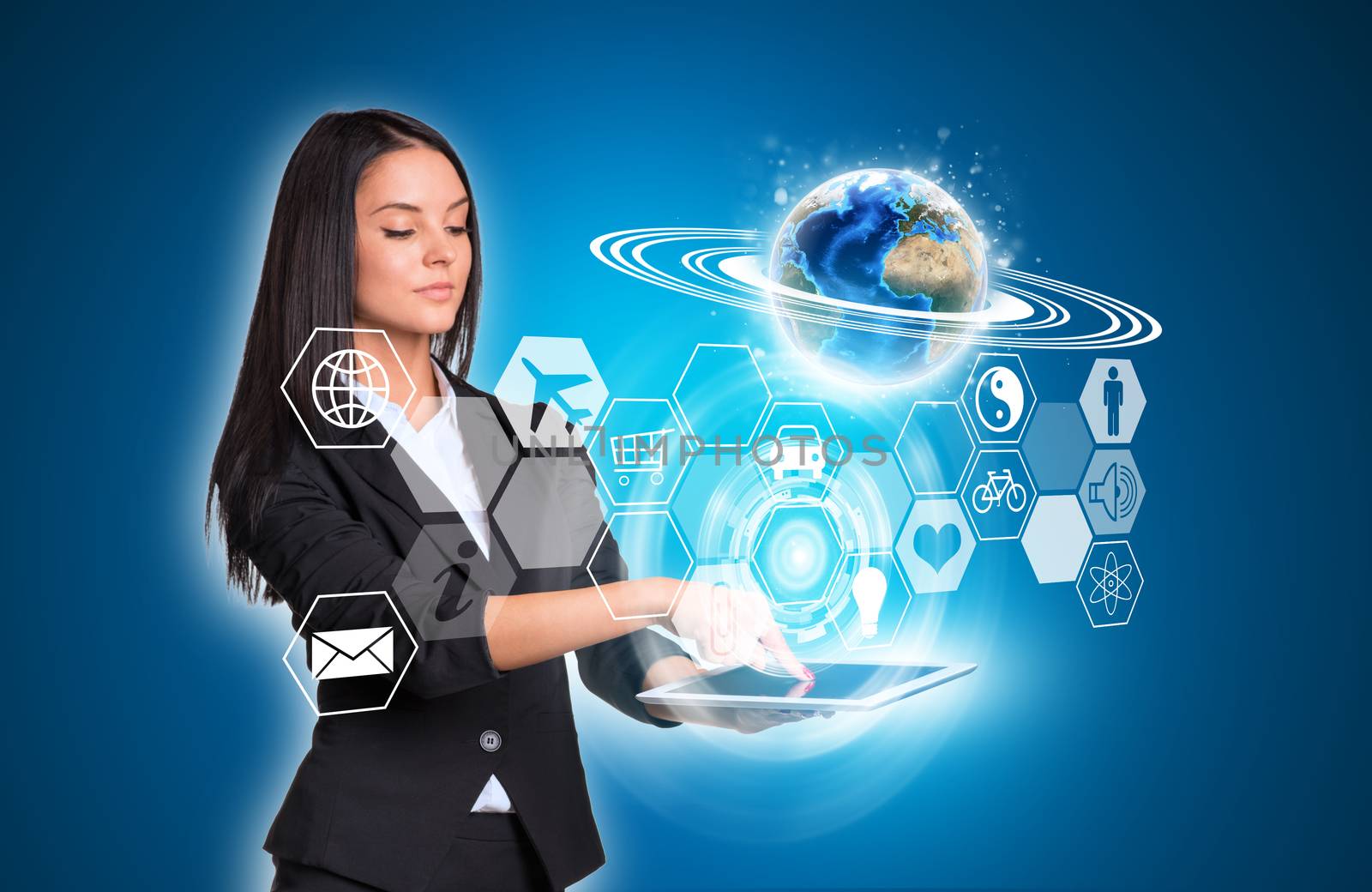 Beautiful businesswomen in suit using digital tablet. Earth and transparent hexagons with icons. Element of this image furnished by NASA