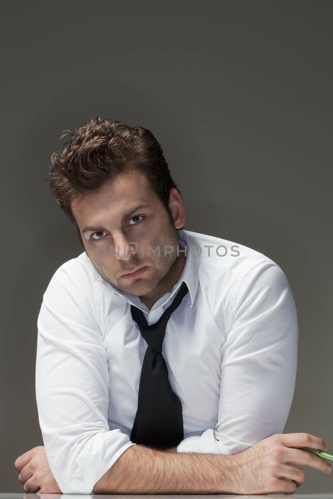 businessman in white shirt looking, thinking - isolated on gray