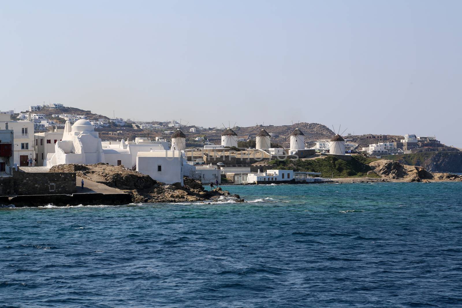 View from the sea of the famous Mykonos wind mills