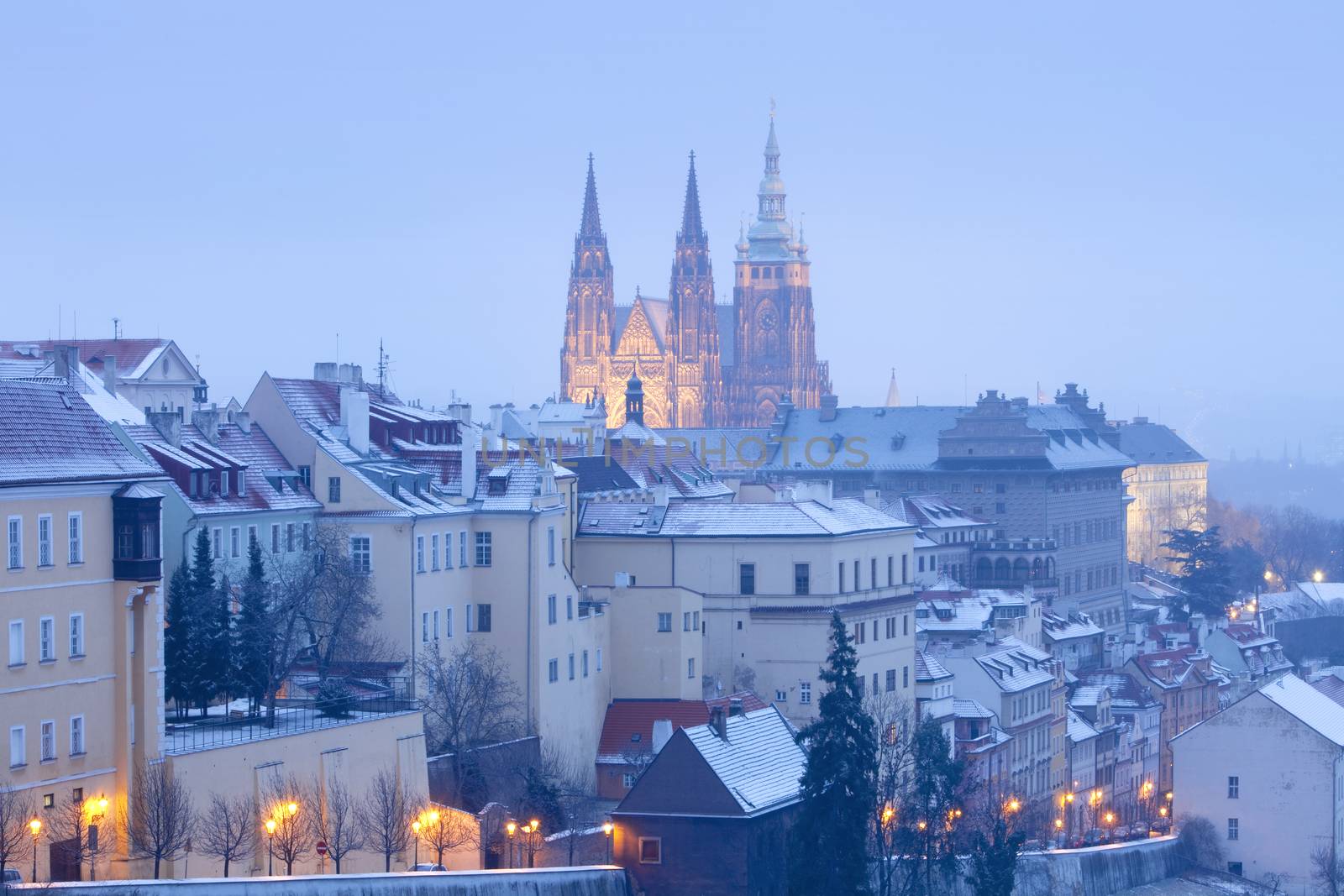 prague in winter - lesser town (mala strana) and hradcany castle at dusk