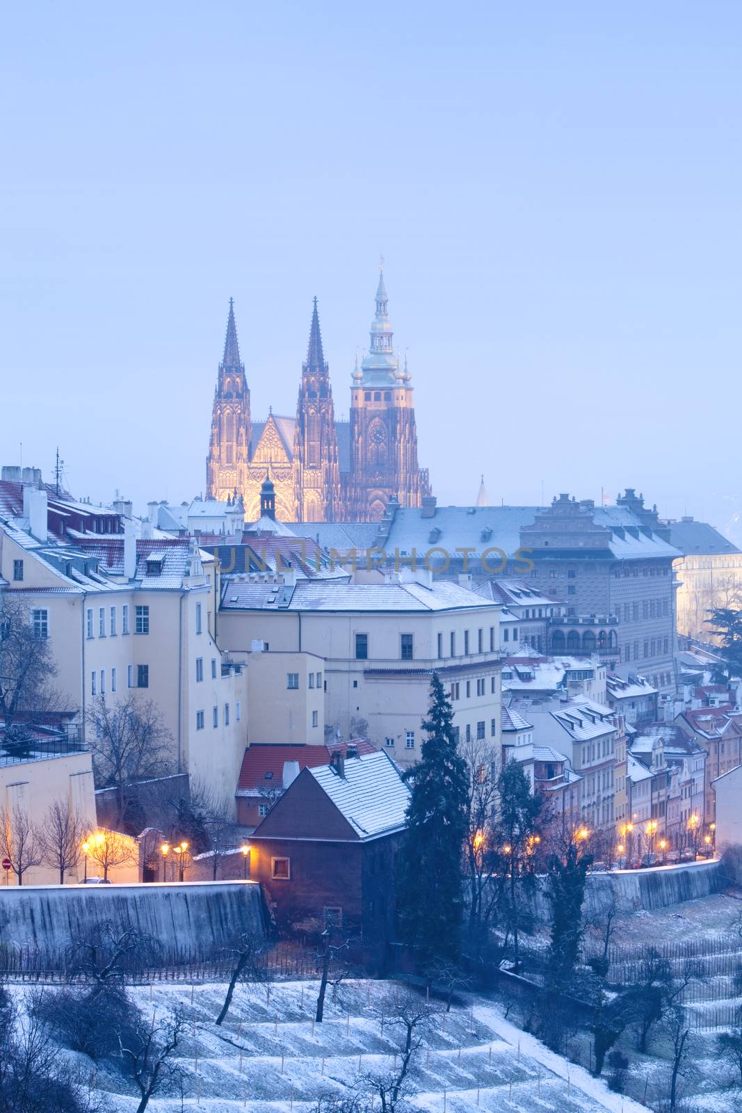 prague in winter - lesser town (mala strana) and hradcany castle at dusk