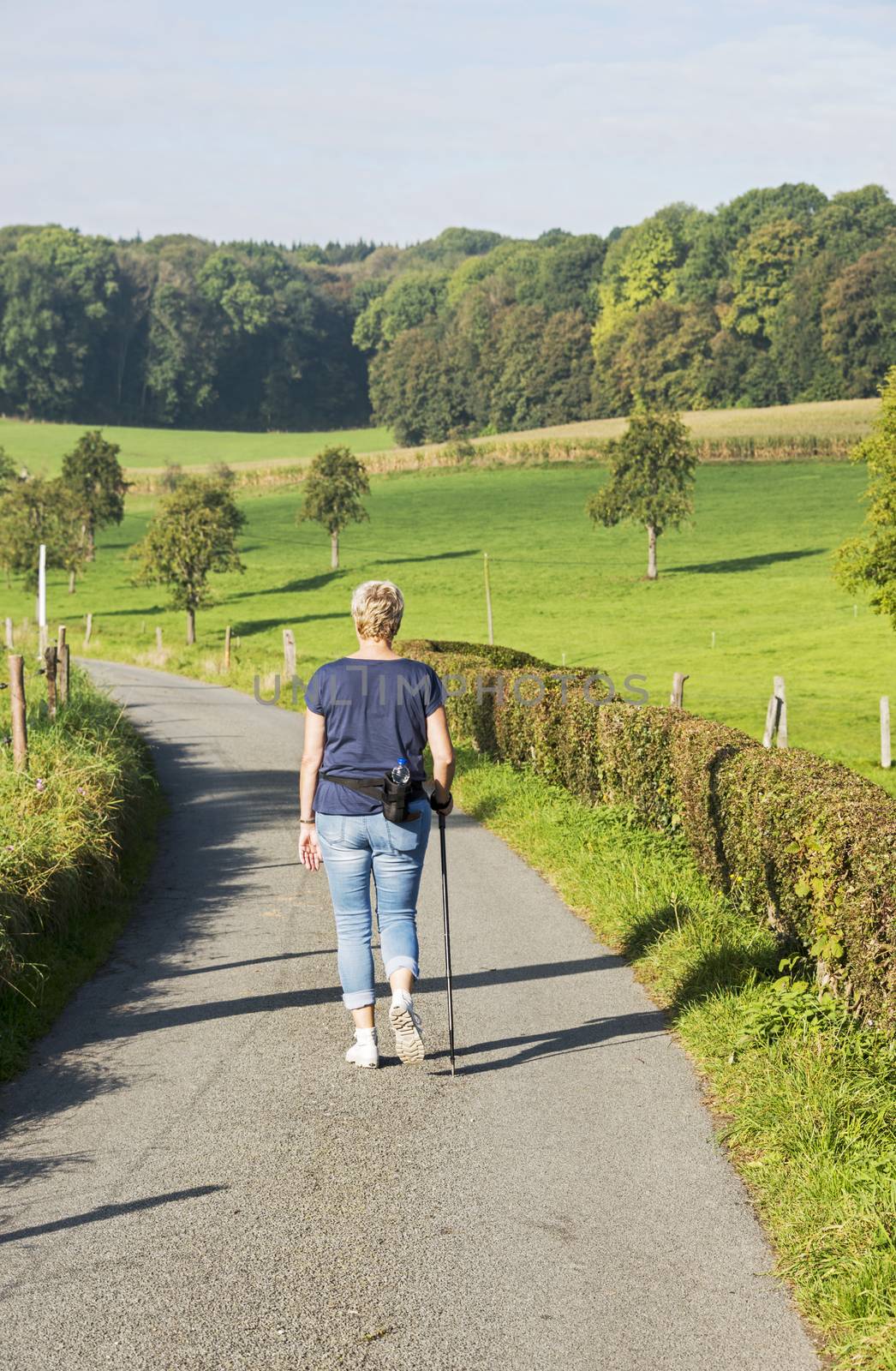 woman walking on countryside by compuinfoto