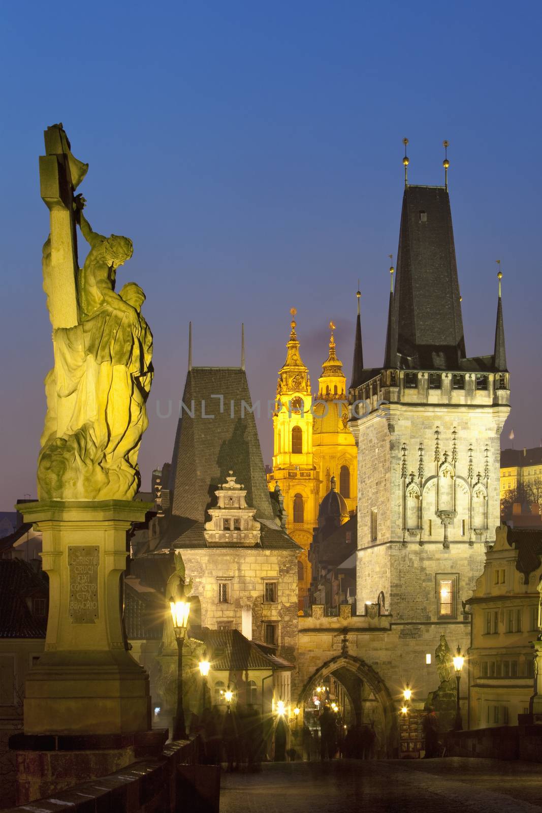 czech republic prague - charles bridge and st. nicolaus church at dusk