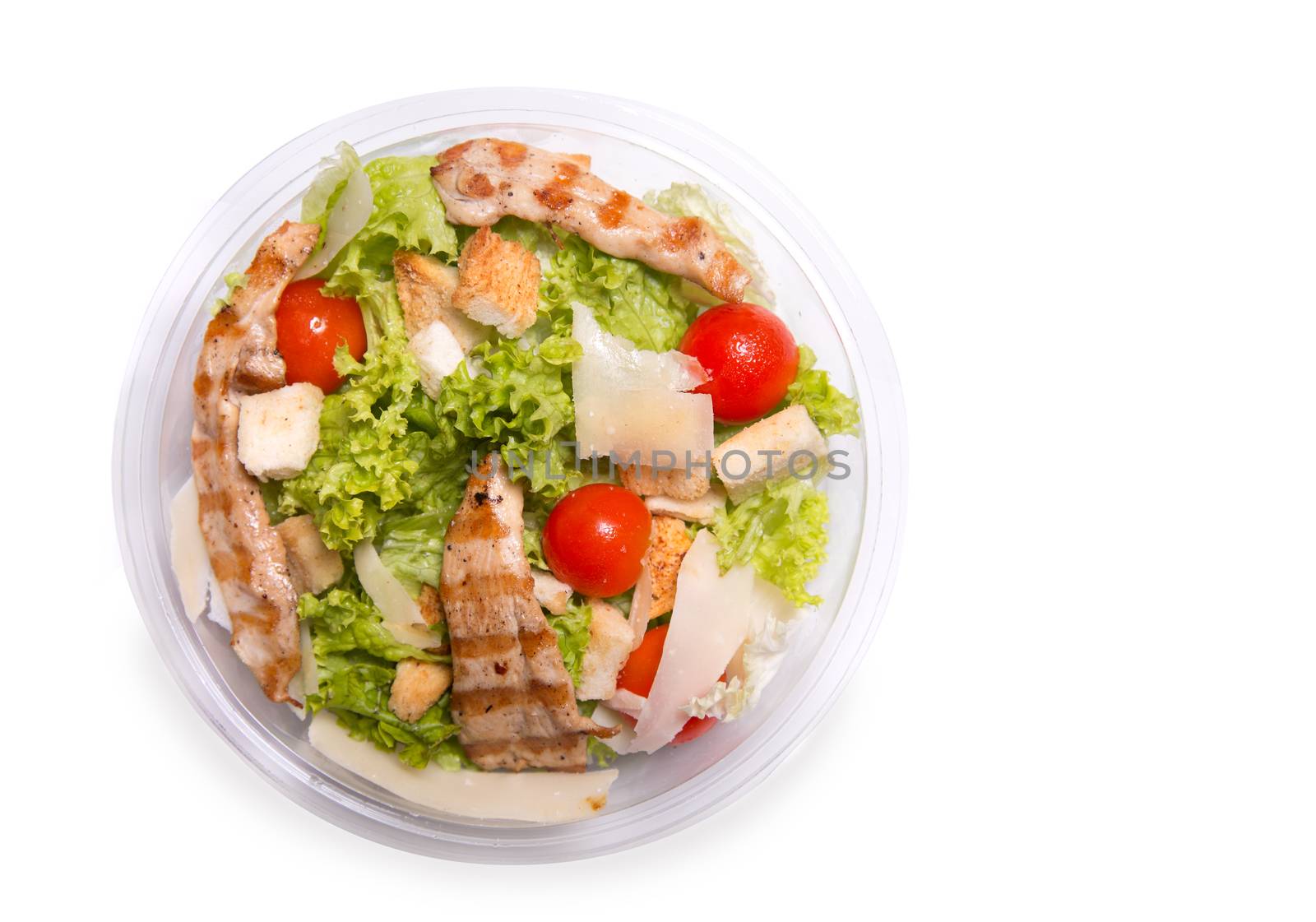 Caesar salad with grilled chicken meat, top view isolated on white background 