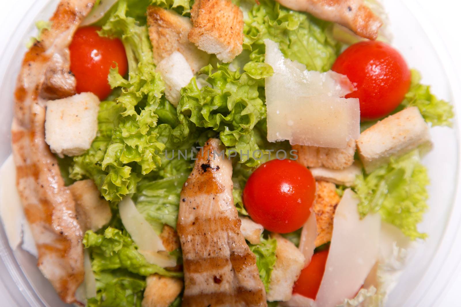 Delicious Caesar salad with grilled chicken meat  by Elisanth