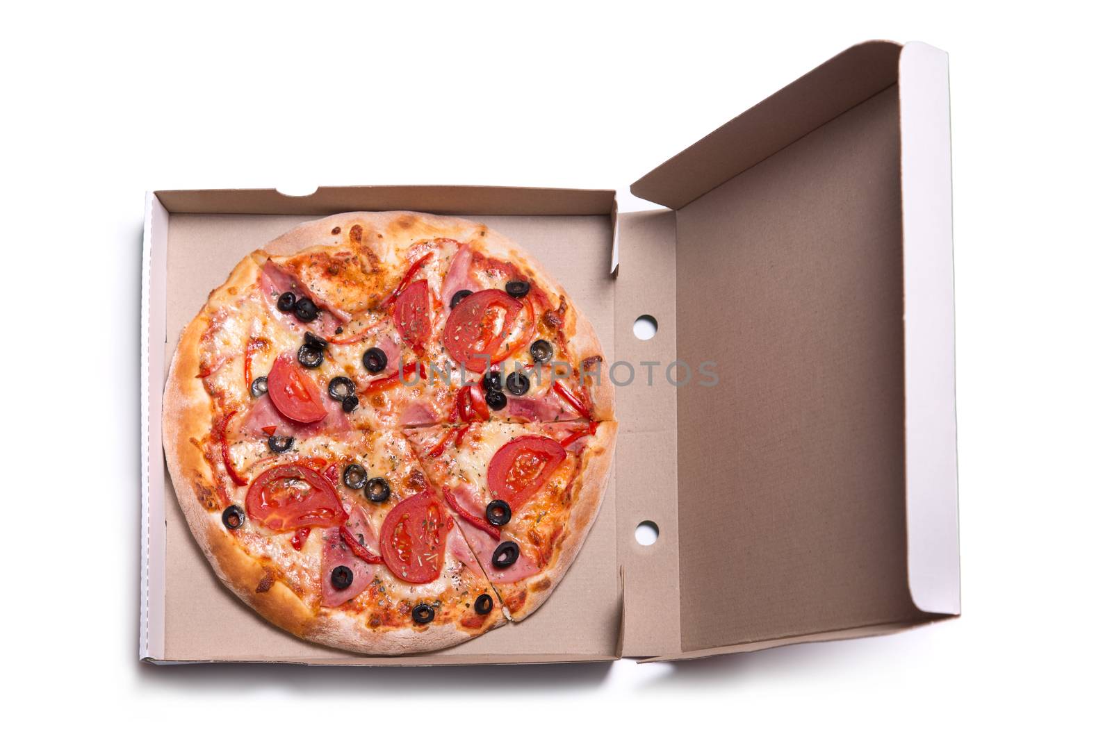 Delicious pizza with ham and tomatoes in box, isolated on white background 