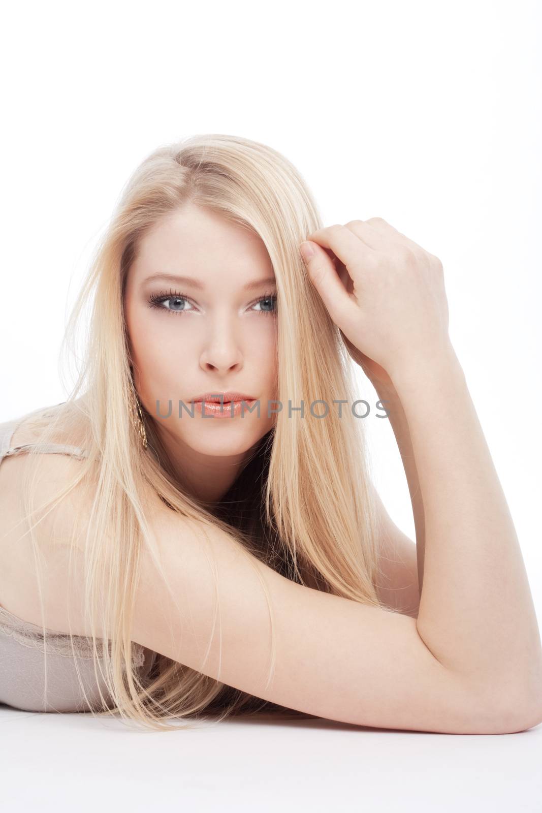 portrait of a young beautiful blond woman with blue eyes - isolated on white