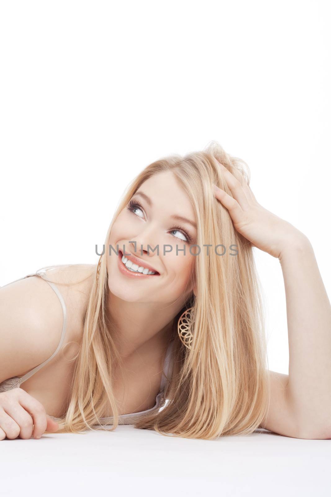 portrait of a young beautiful blond woman with blue eyes - isolated on white