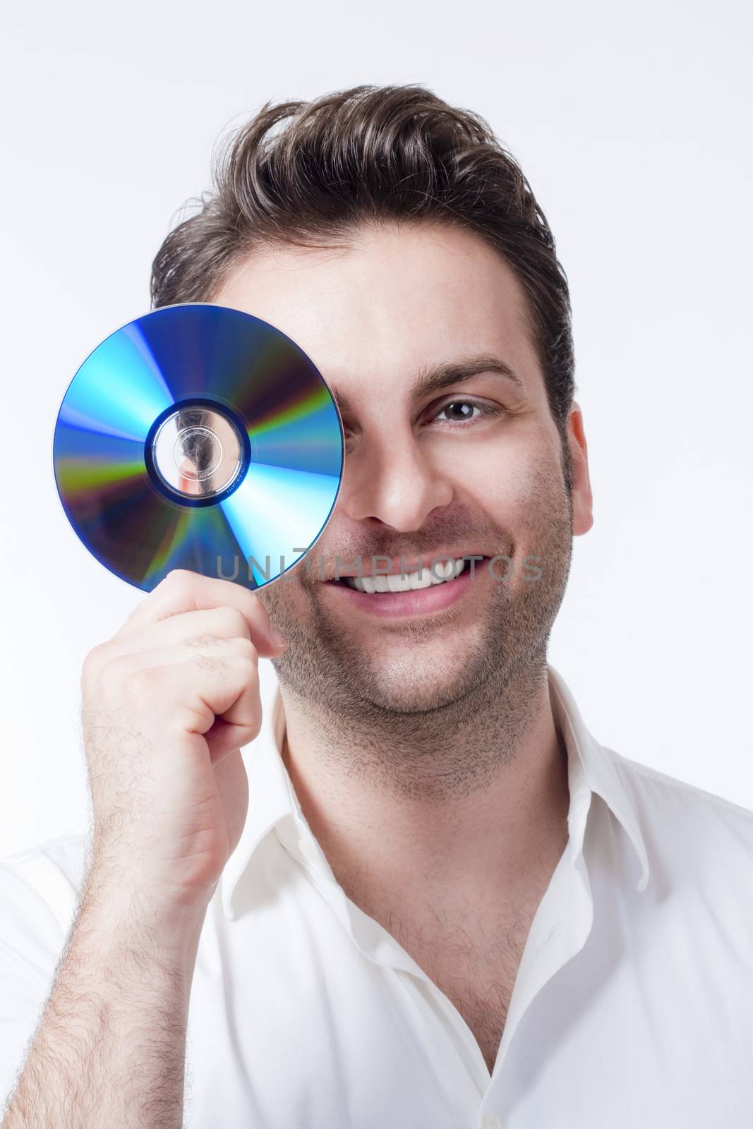 man in shirt standing smiling holding CD - isolated on white