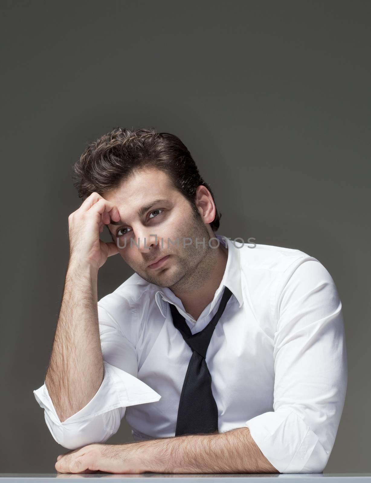 businessman in white shirt looking, thinking - isolated on gray