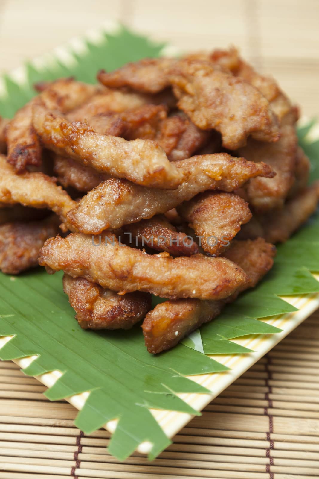 Breaded pork dish Placed on a wooden table.