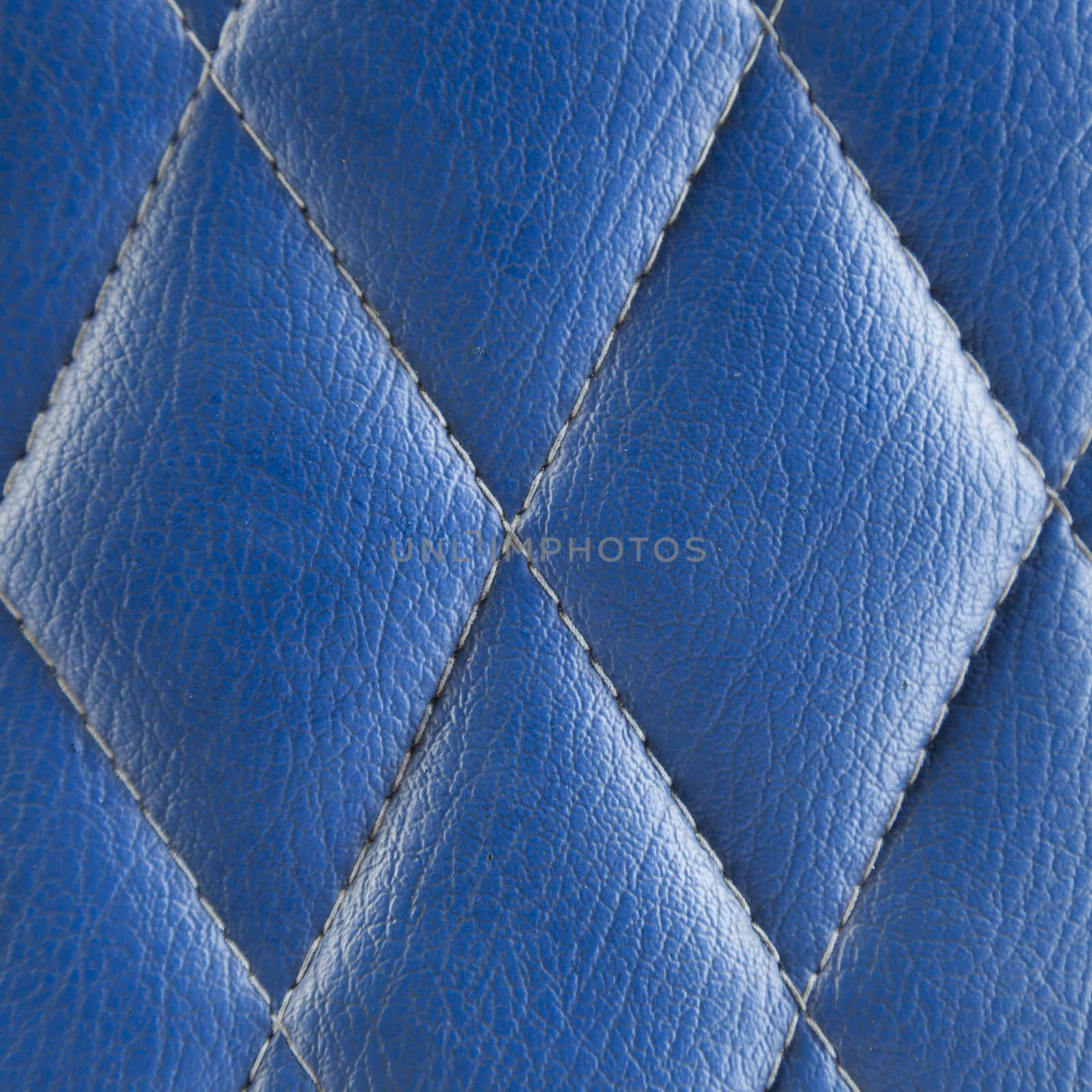 Blue leather seat. A background made ������of leather seat material.