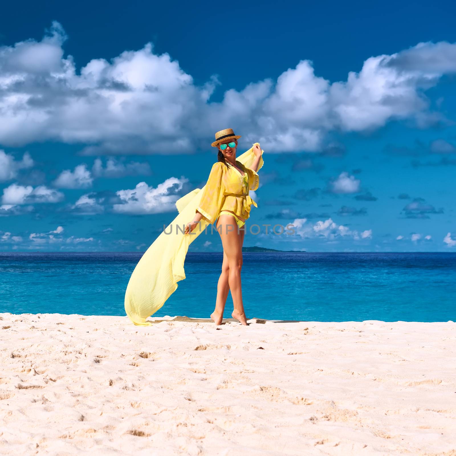 Woman with sarong at Seychelles beach