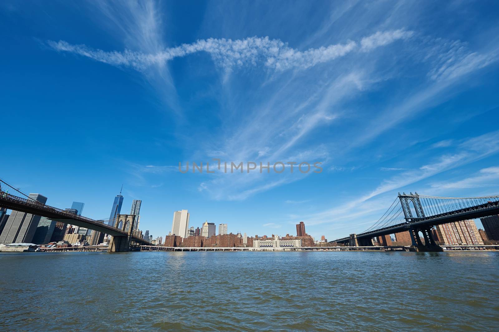 Manhattan skyline view from Brooklyn between Brooklyn Bridge and Manhattan Bridge in New York City