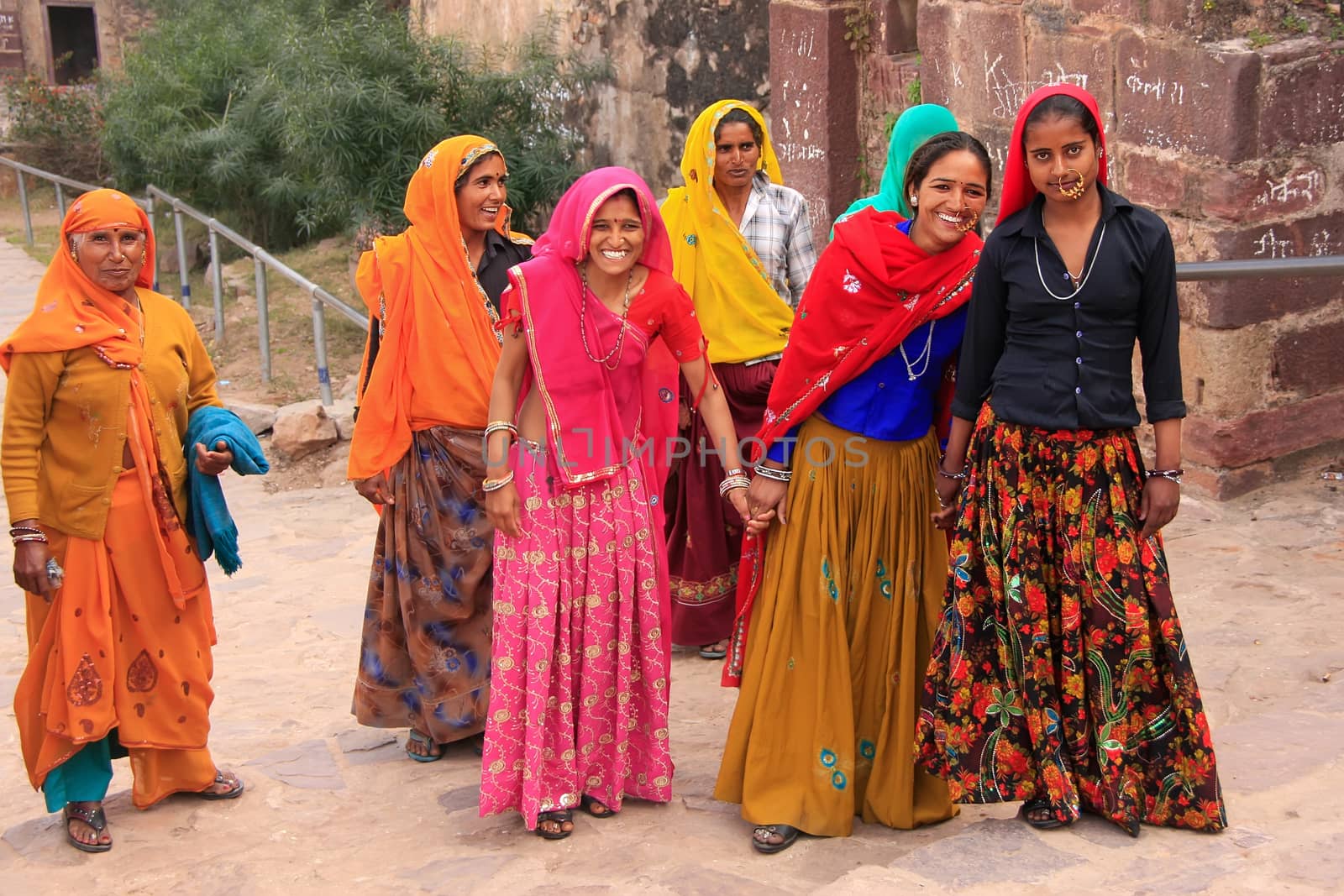 Indian women in colorful saris walking up the stairs at Ranthambore Fort, Rajasthan, India