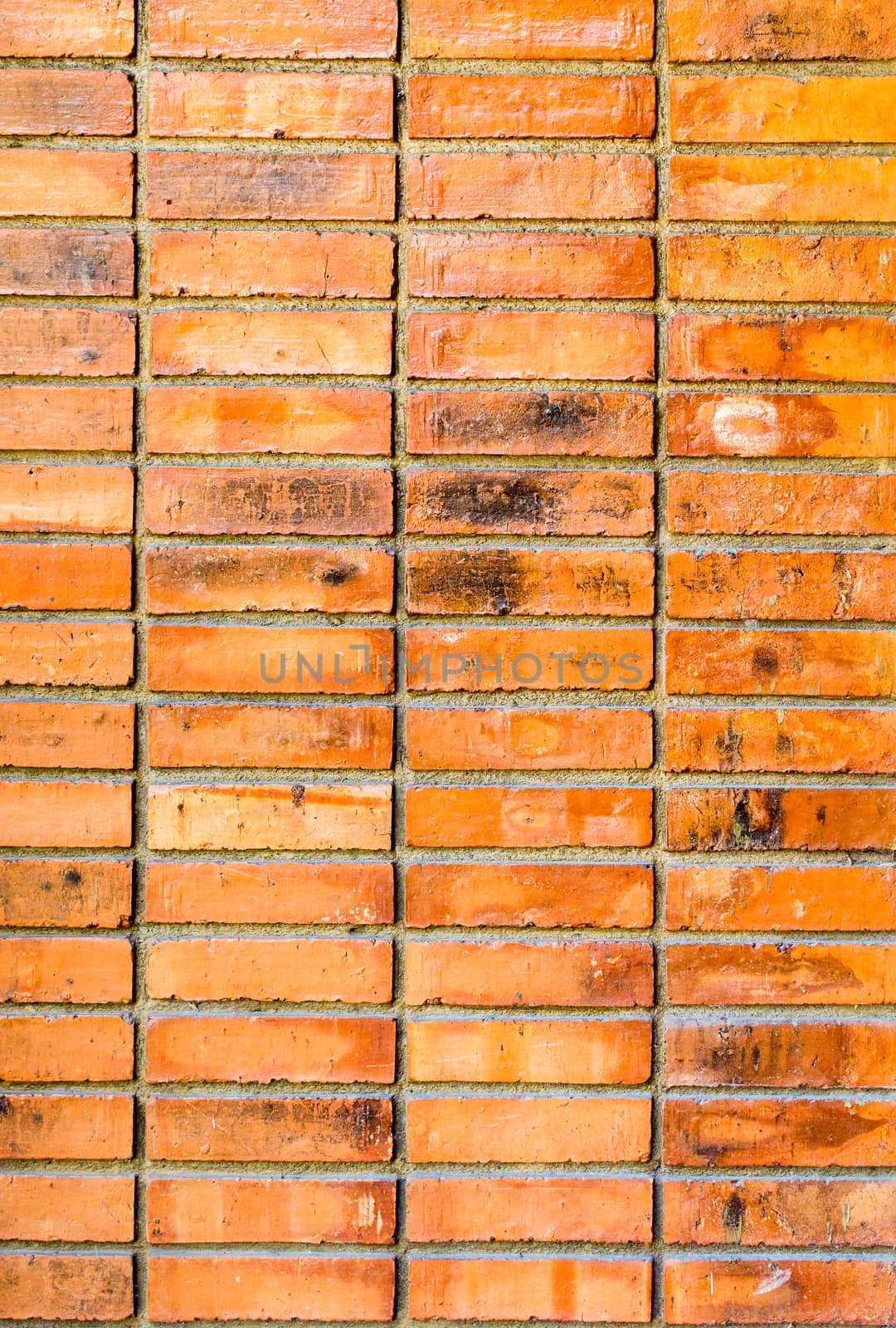 Background of orange brick wall texture .