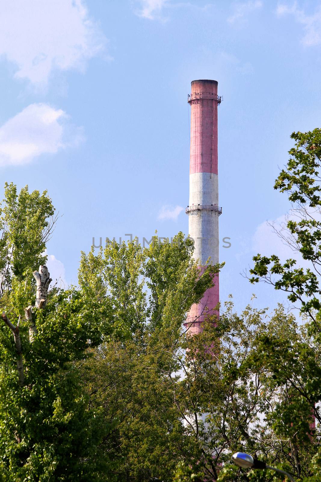pipes of thermal power plant against blue sky