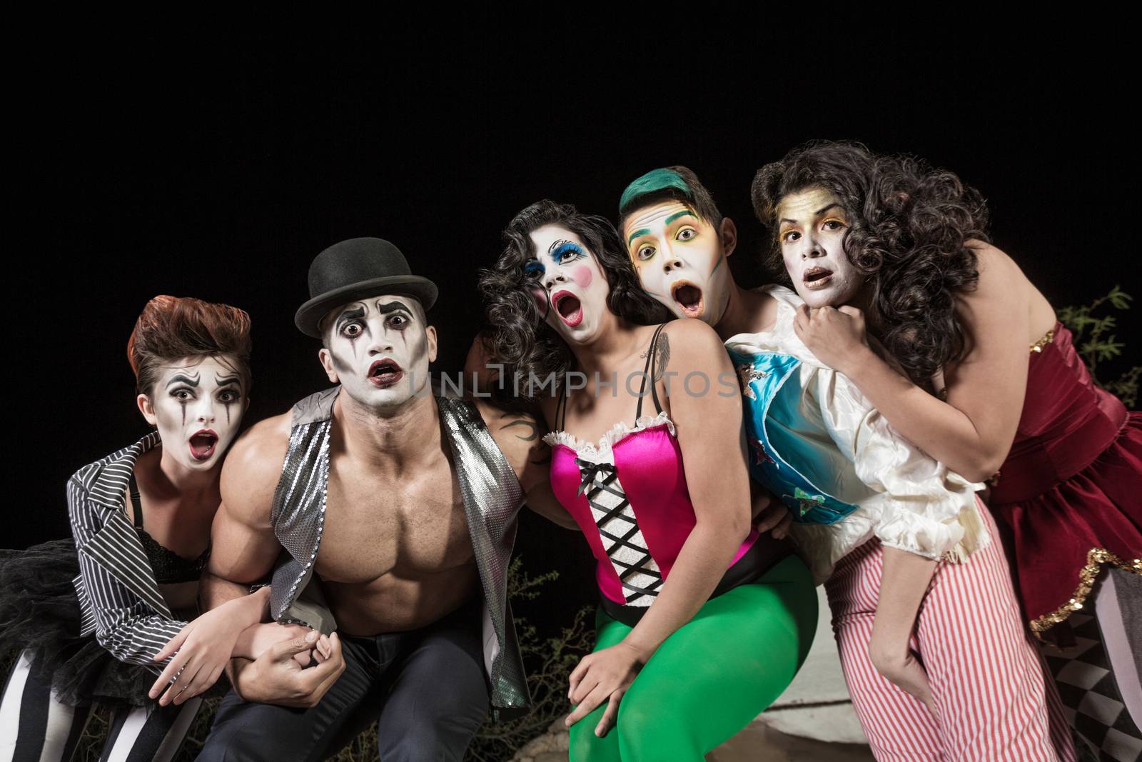 Surprised group of character clowns at theater