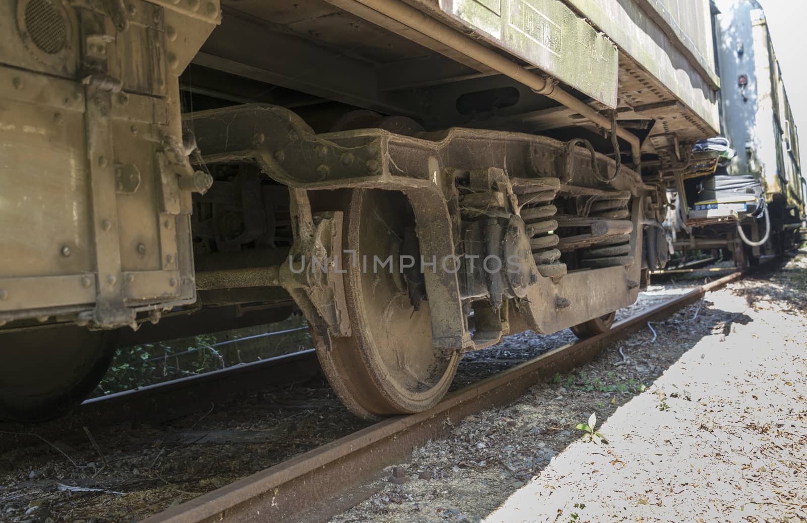 old rusted dirty wheels from train on railroad