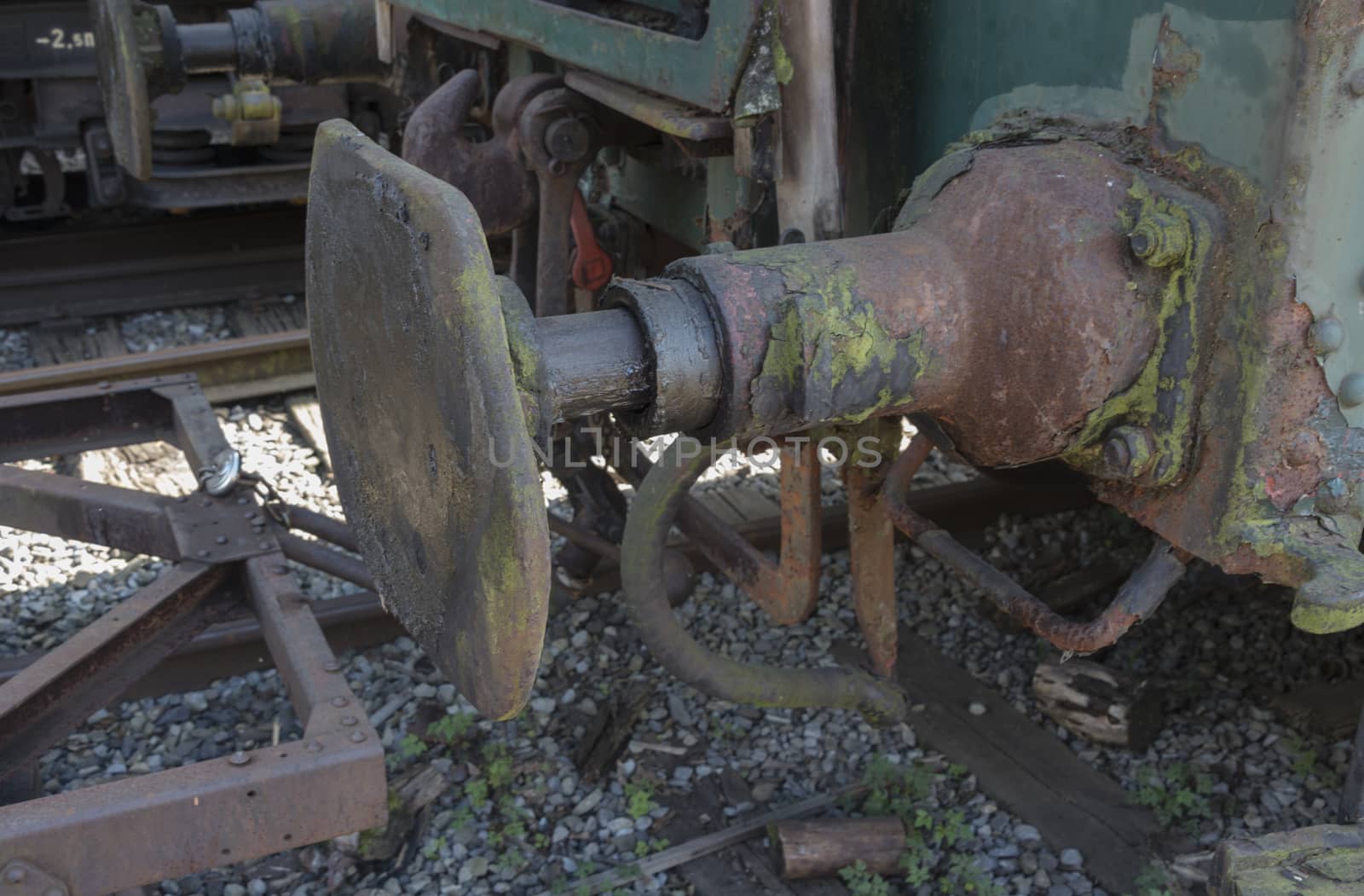 iron old rusted train buffer with railroad track