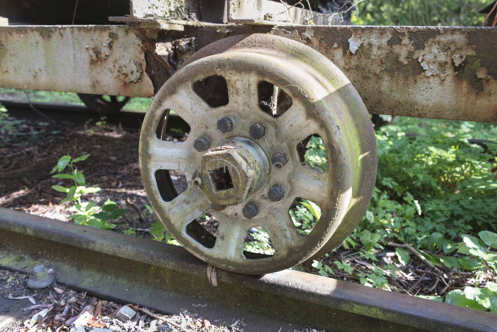 detail old rusted wheel from train with studbolds