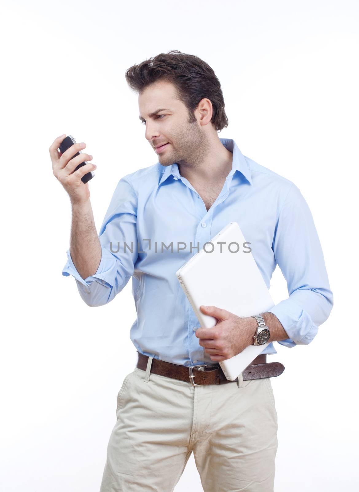 businessman with laptop looking at cellphone - isolated on white