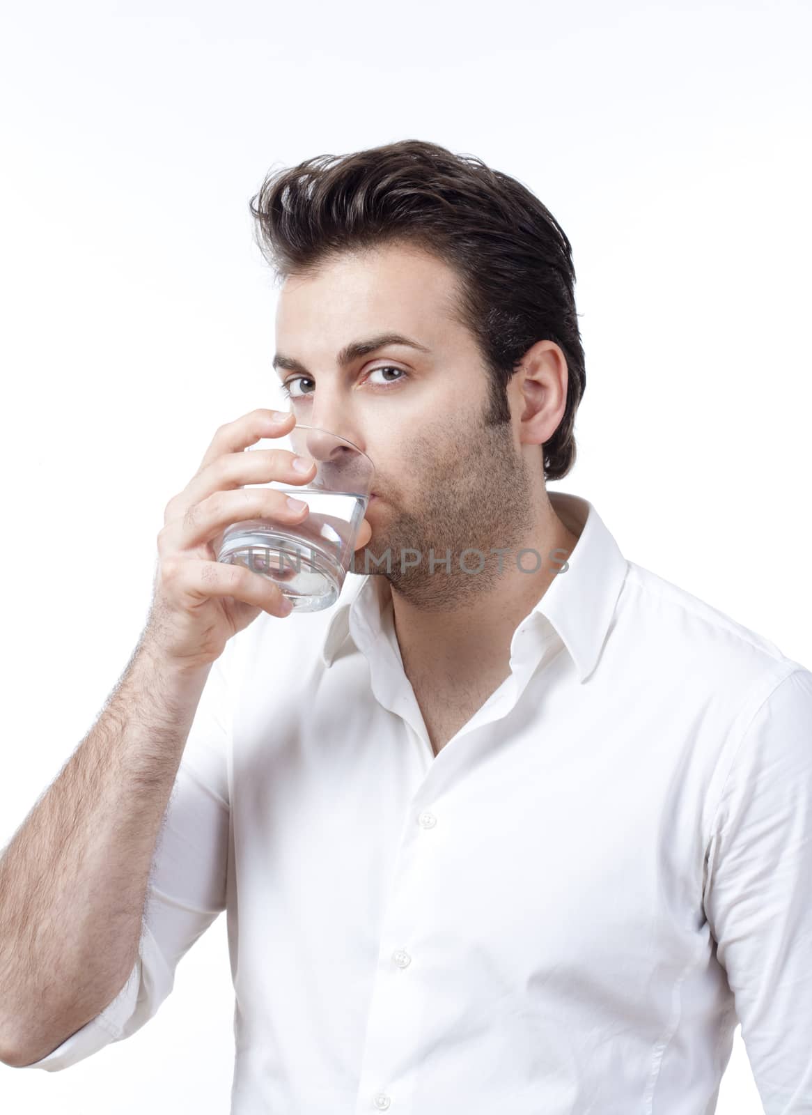 man holding glass of water by courtyardpix