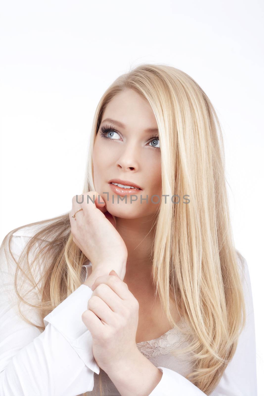 portrait of a young beautiful blond woman with blue eyes - isolated on white