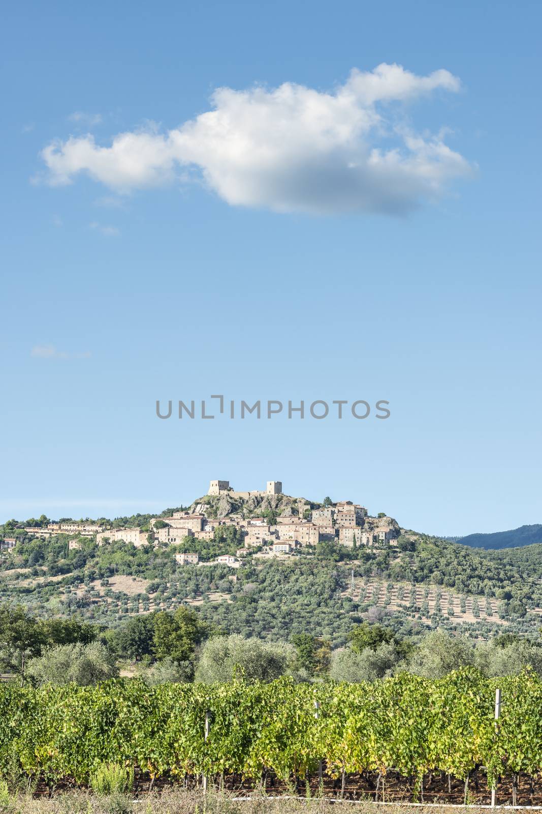 View to Montemassi and landscape in Tuscany Italy in autumn with blue sky