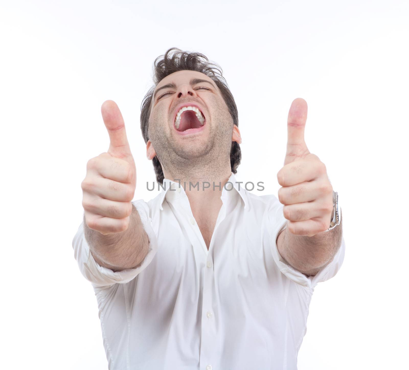 excited man laughing holding his both thumbs up - isolated on white