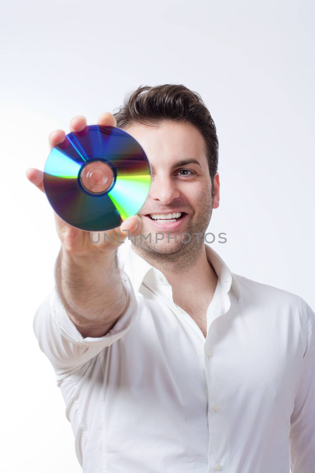 man in shirt standing smiling holding CD - isolated on white