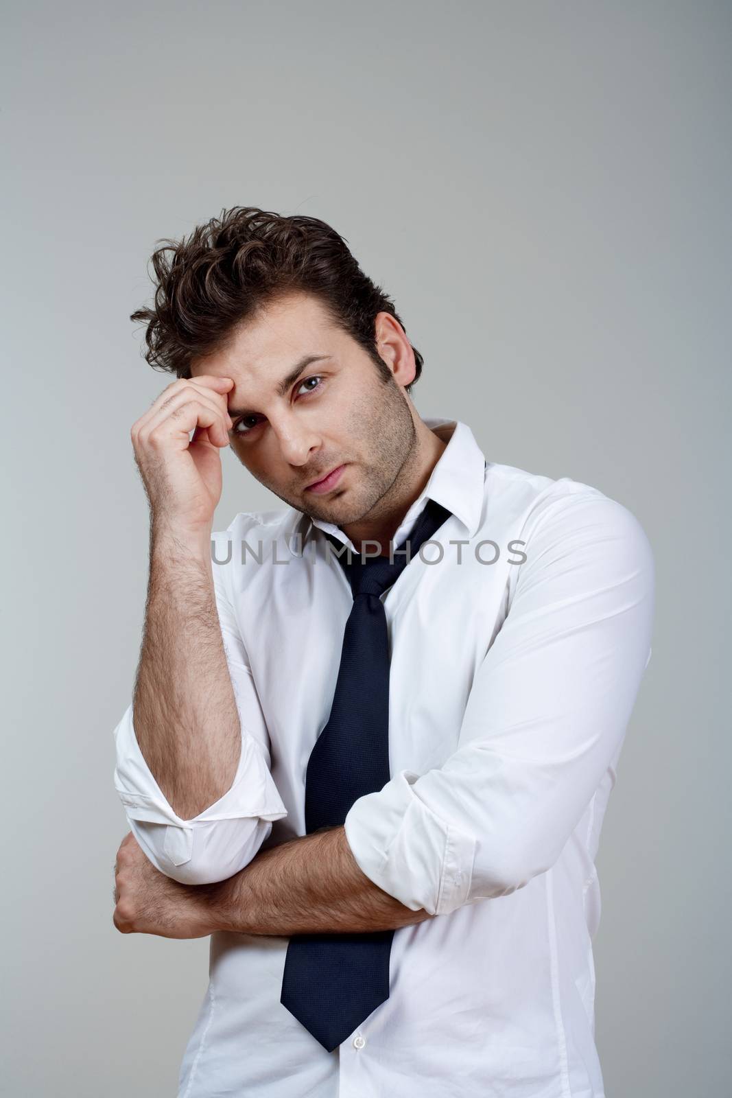 businessman in white shirt and tie, concerned, worried - isolated on gray