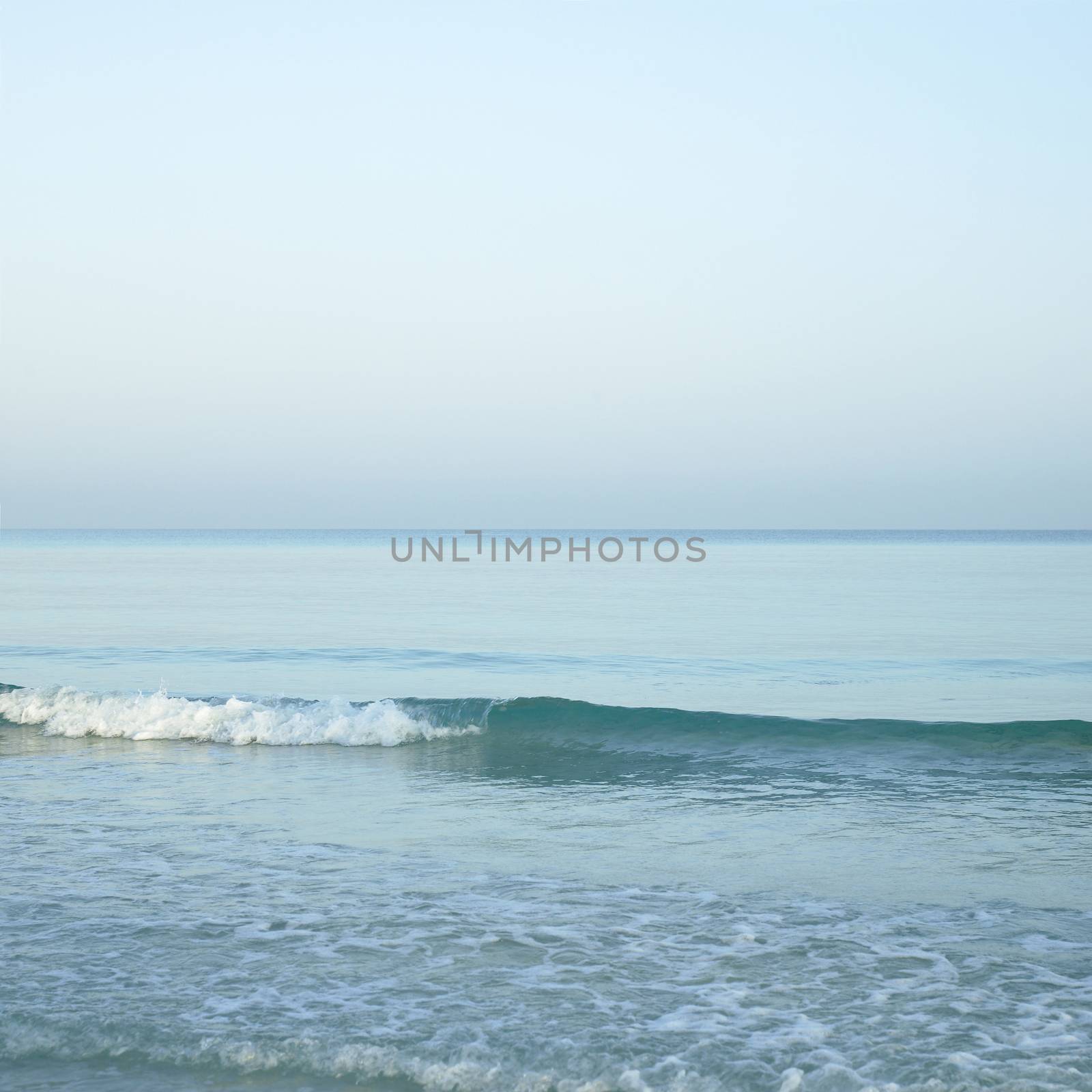 Turquoise tropical ocean and sandy beach