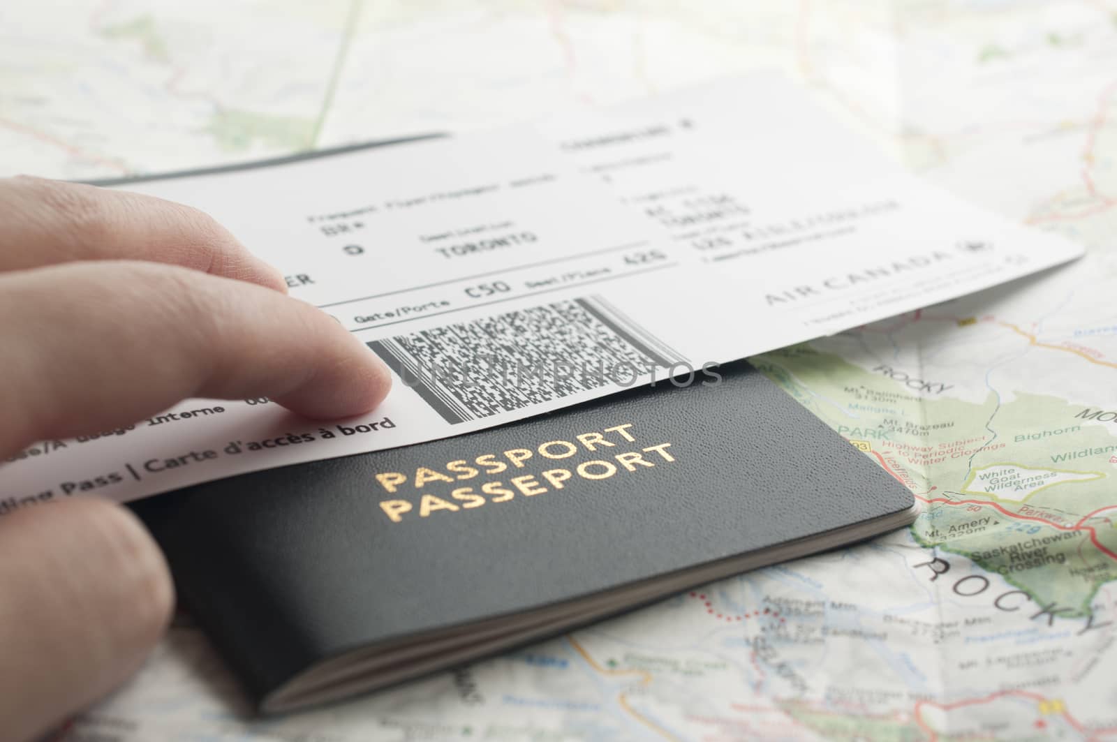 People carrying passport and map ready to travel.