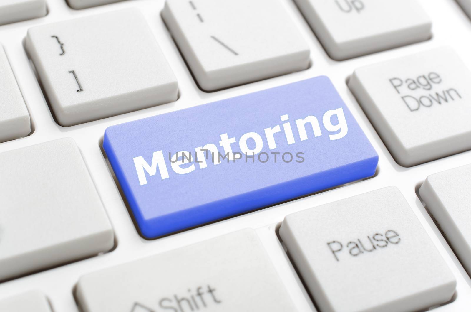 Blue mentoring key on keyboard