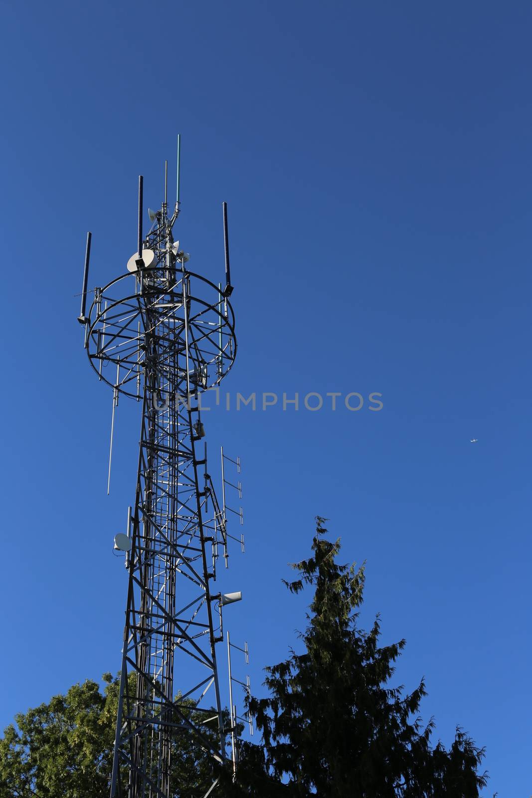 Richmond, BC Canada - September 10, 2014 : Electric high voltage pylon against blue sky in Richmond BC Canada.